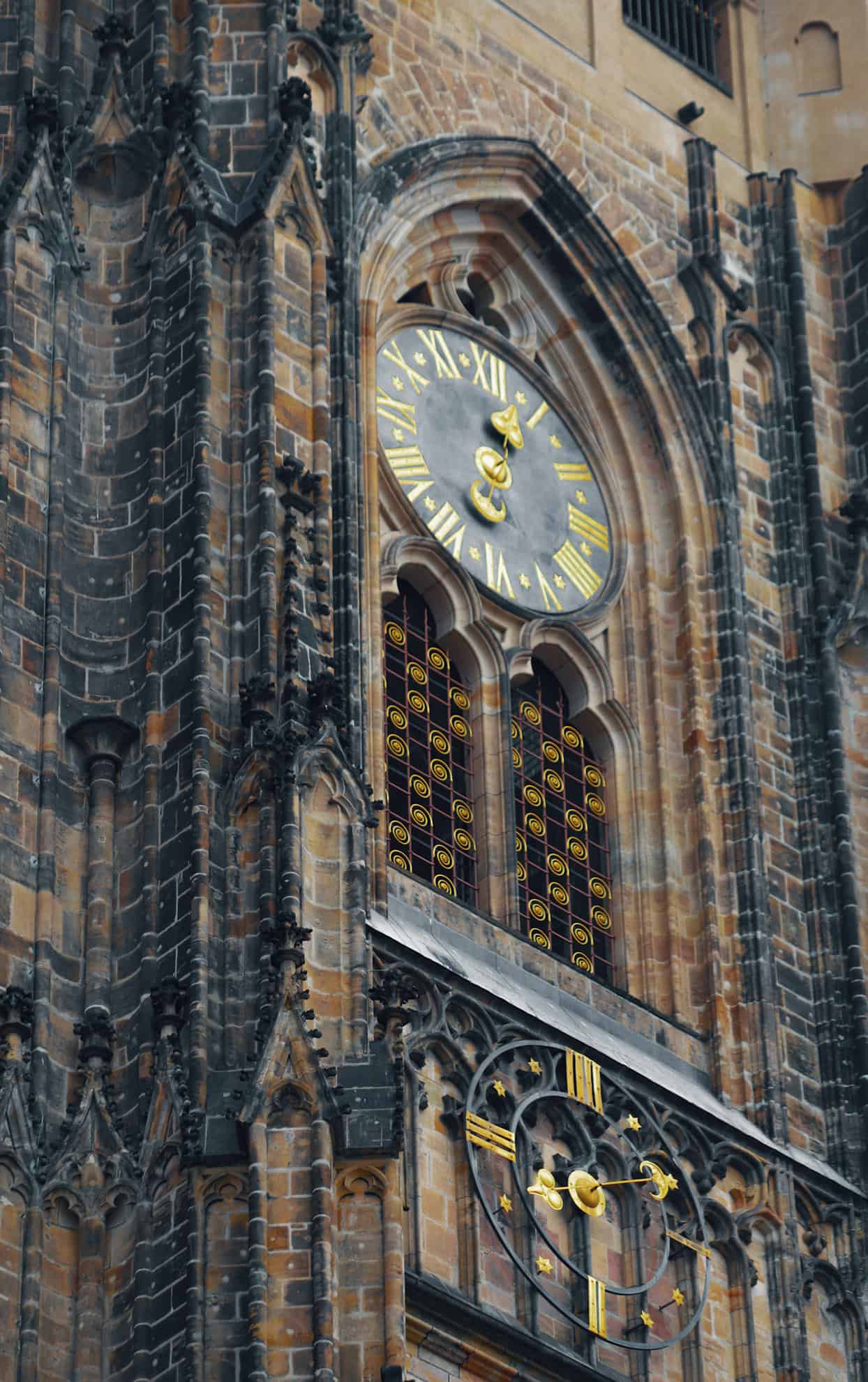 Close-up of clock tower on brick building
