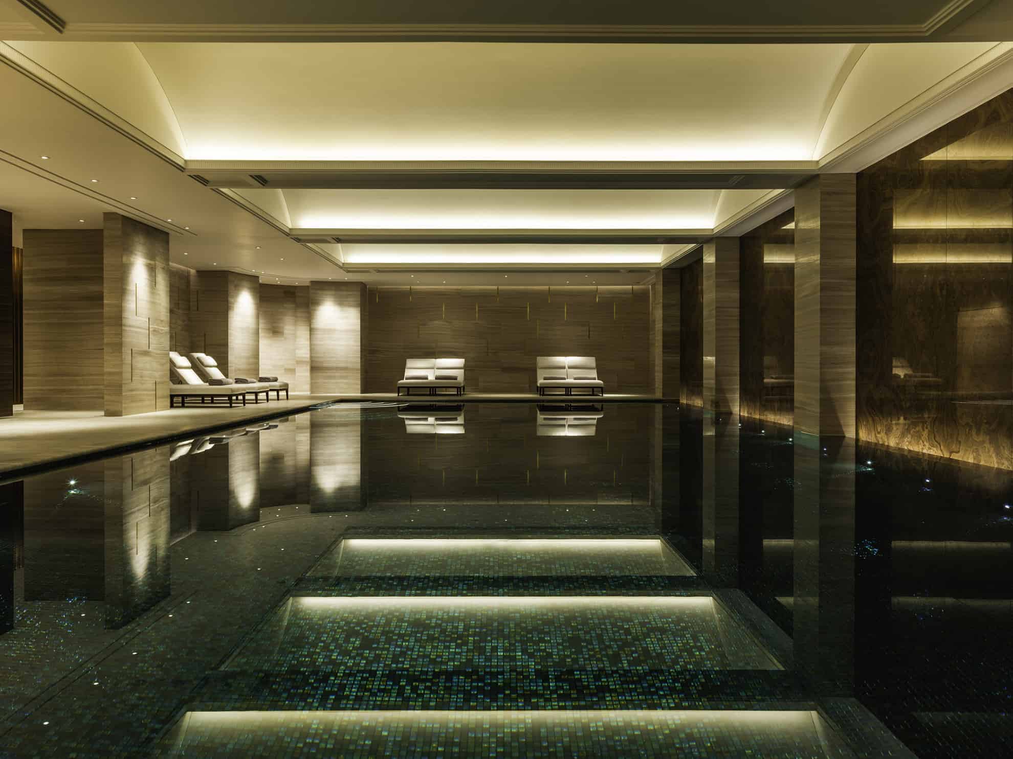Luxurious, marble indoor pool with loungers