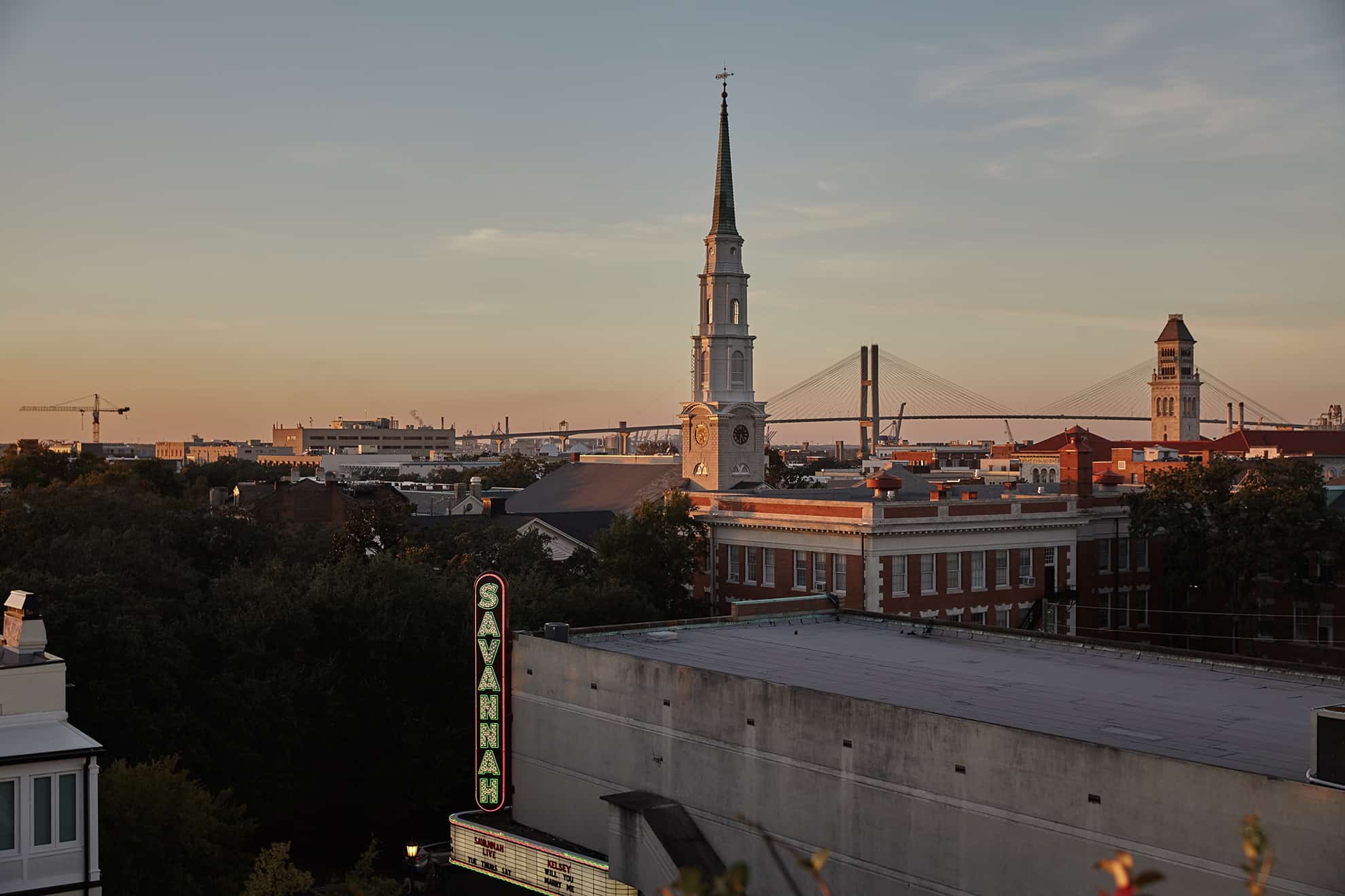 Rooftop city view with tall church steeple in the center