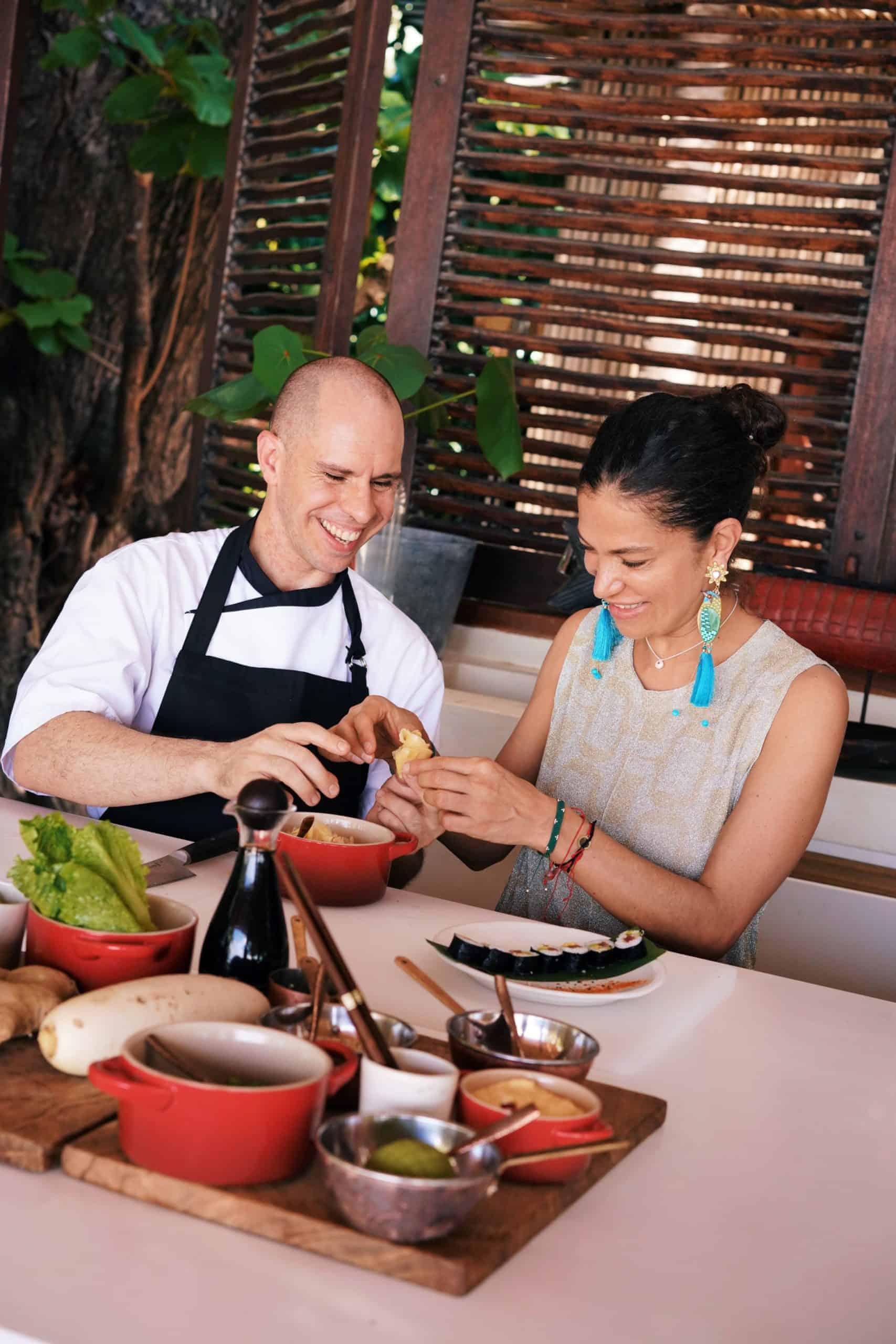 Man and woman preparing Sushi together