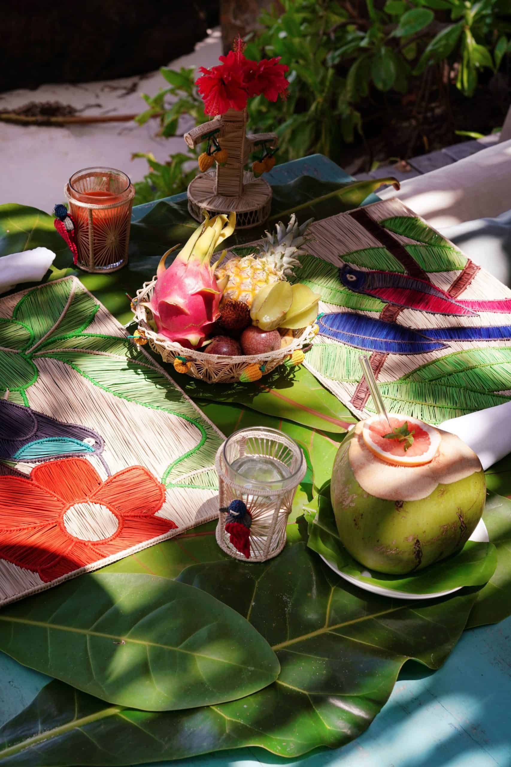 Bowl of tropical fruit on colorful table