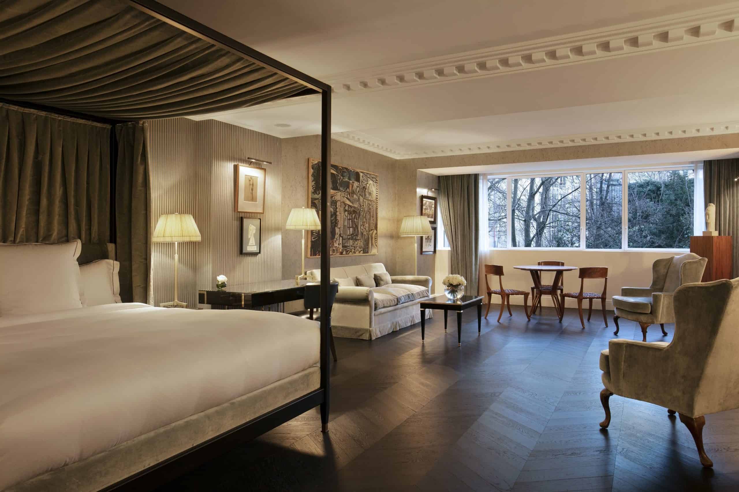 Suite with king-size canopy bed and living area