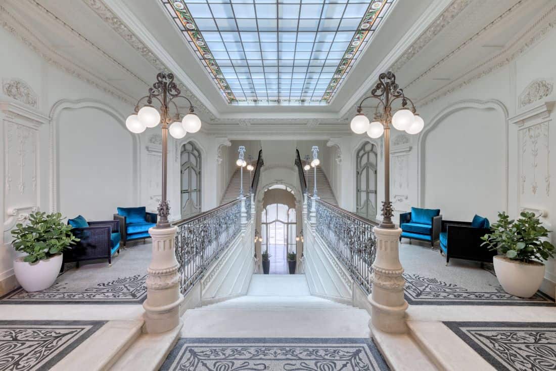 Looking down an elegant marble staircase.