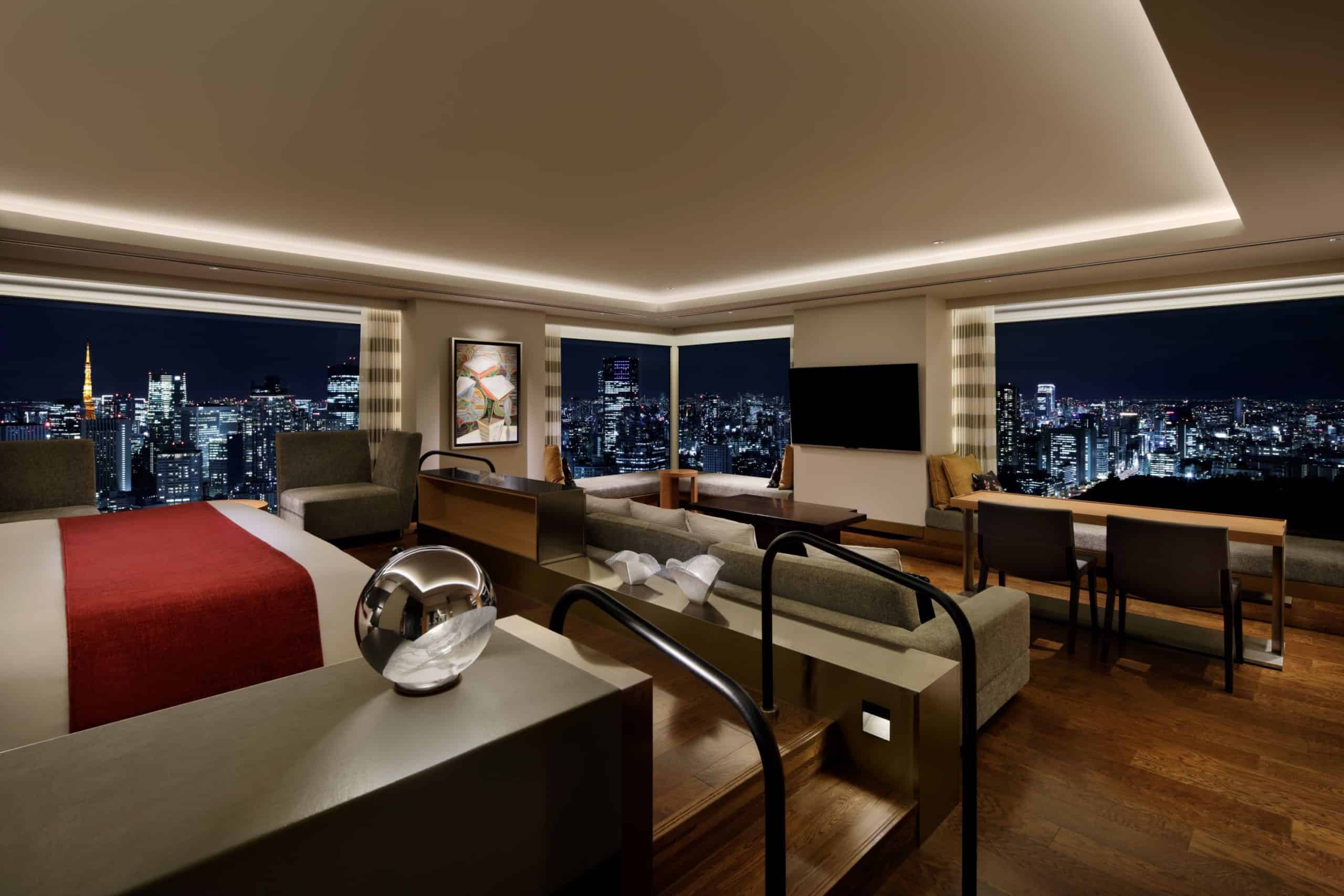 Multi-level suite with wraparound city view at night