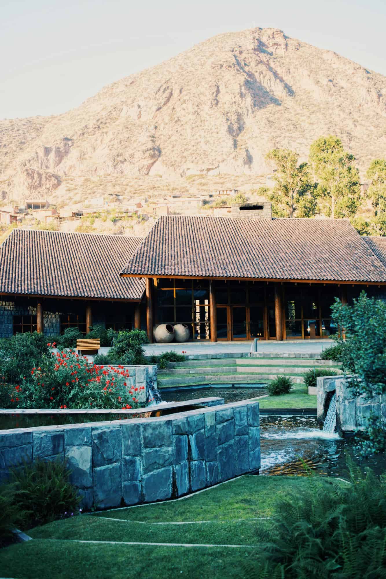 Outdoor hotel grounds with mountain behind