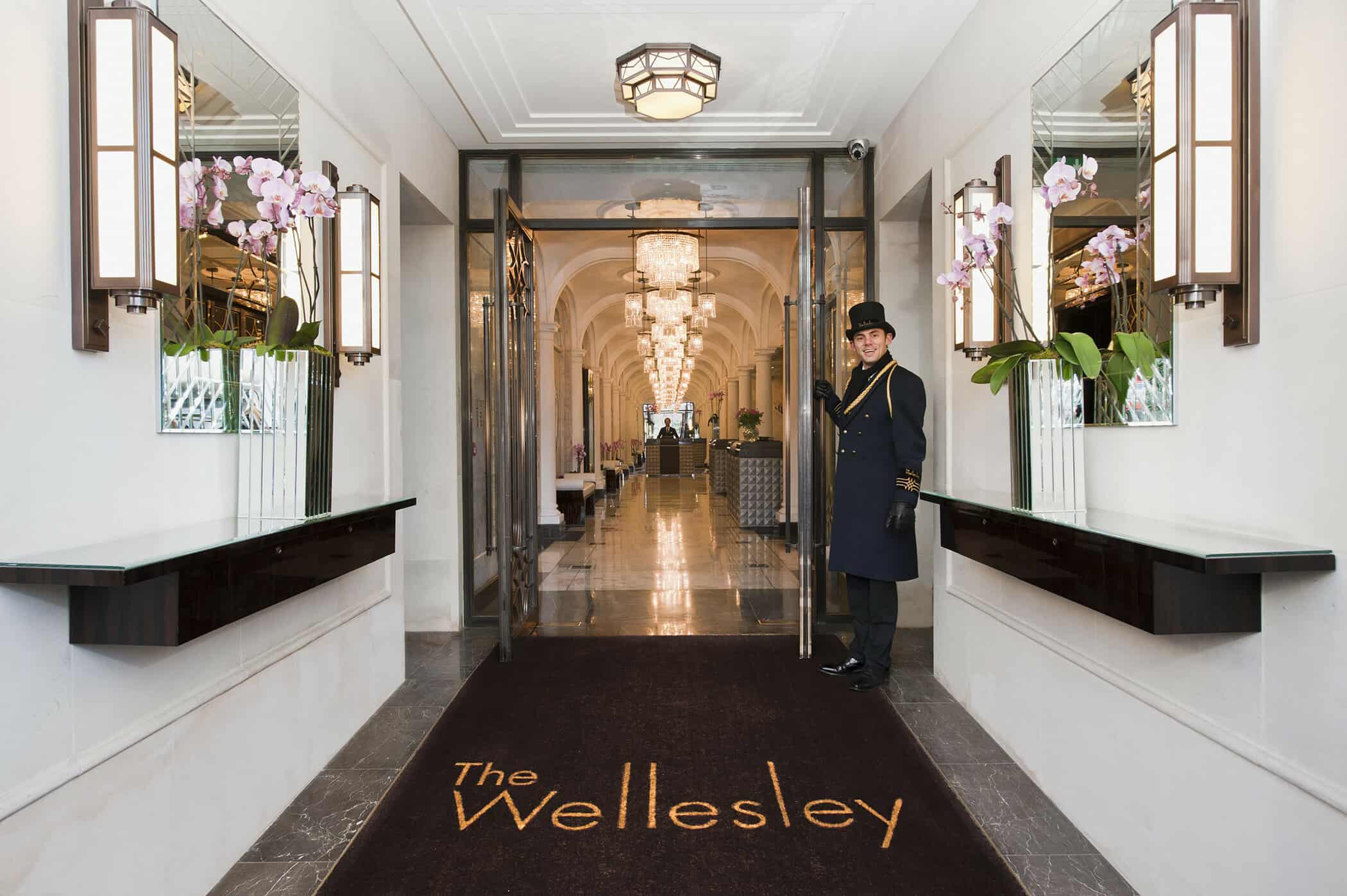 Doorman holding open doors at The Wellesley Hotel