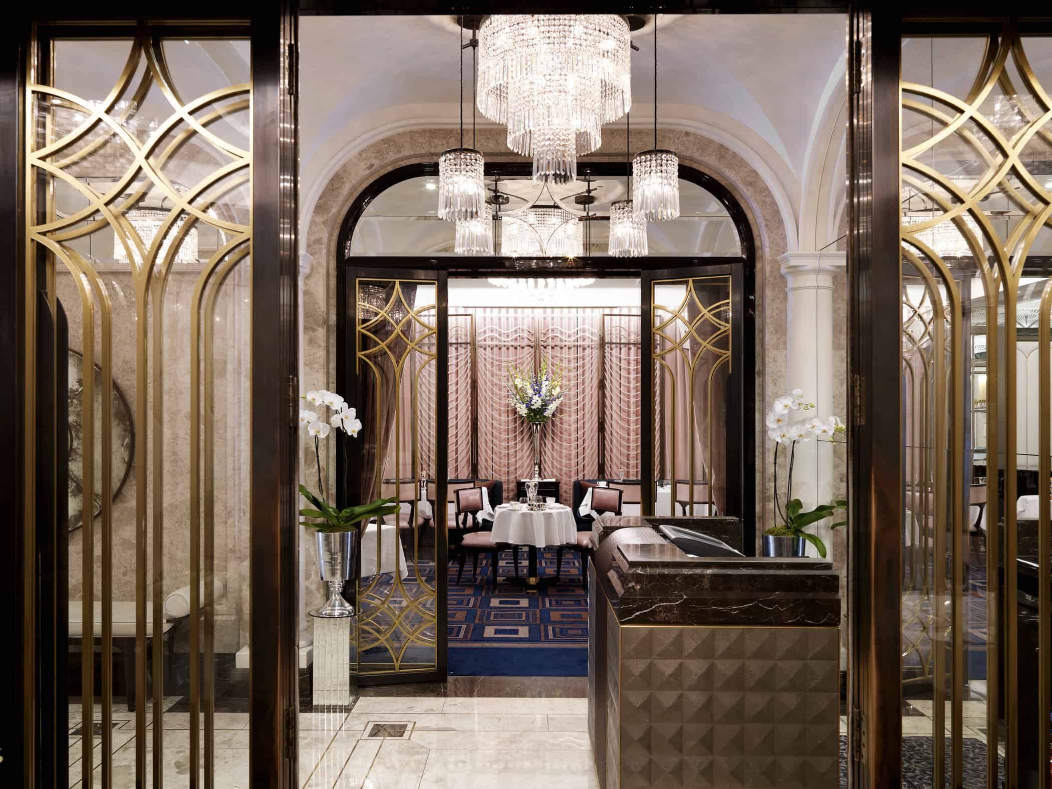 Upscale entry of hotel restaurant with crystal chandeliers
