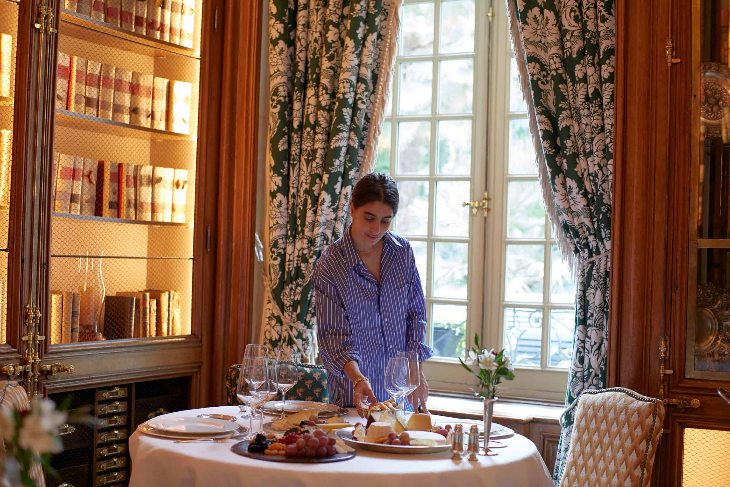 A woman setting an elegant table