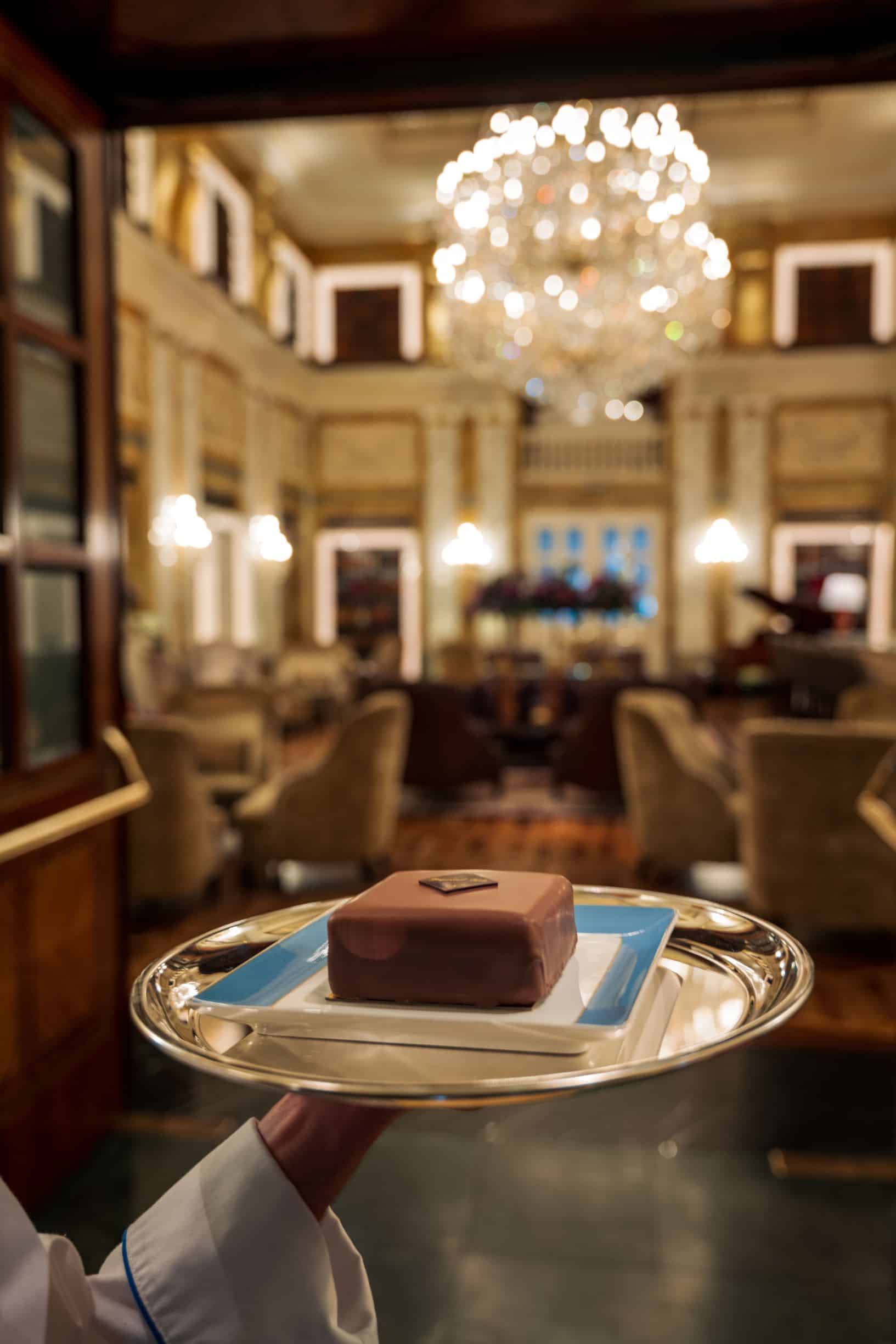 server carrying plate of torte
