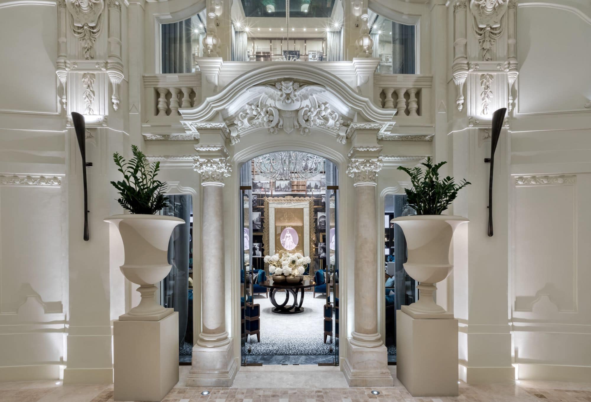 Hotel lobby with European architecture, columns, and statues