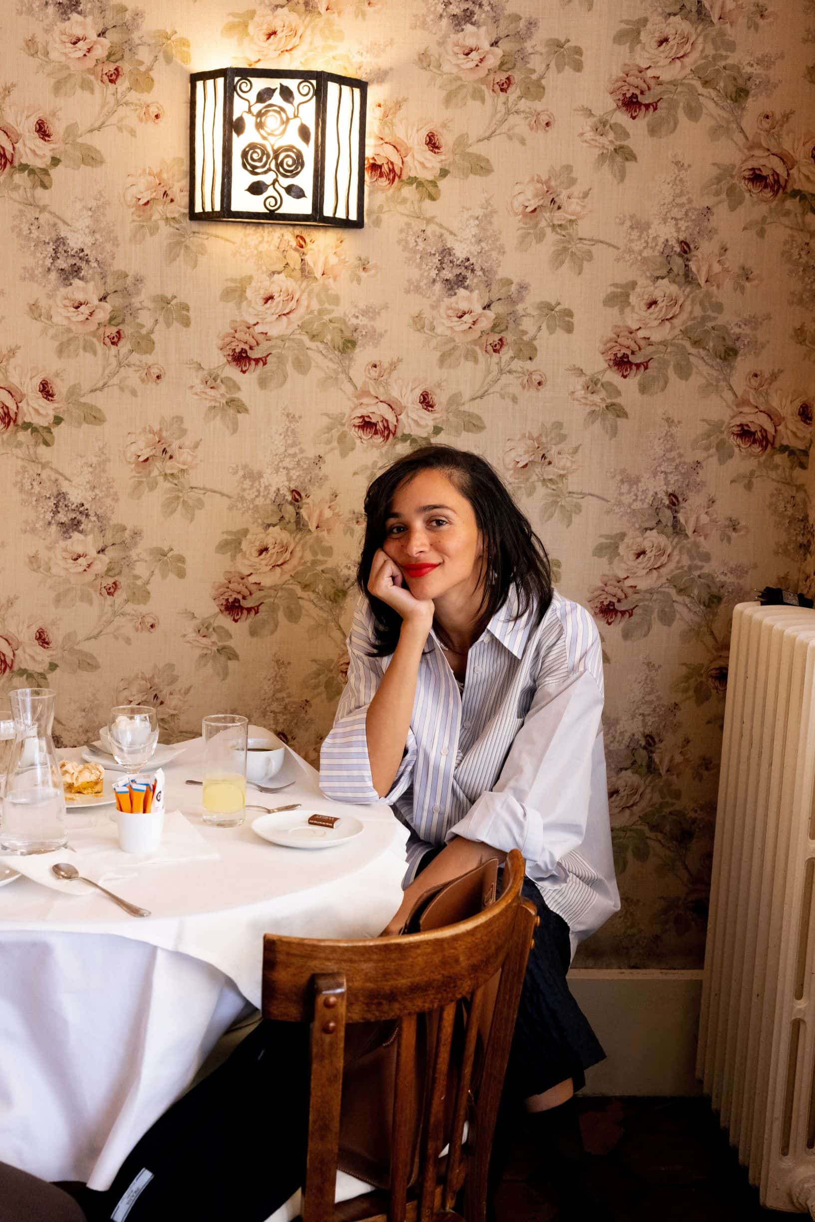 woman sitting at breakfast table